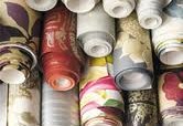 rolls of wall coverings stacked